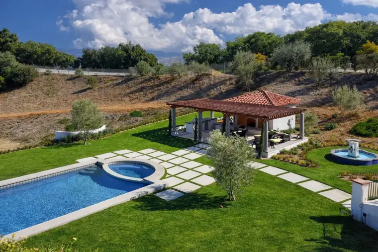 Luxury villa with pool and pergola in scenic mountainous landscape. Perfect for relaxation.